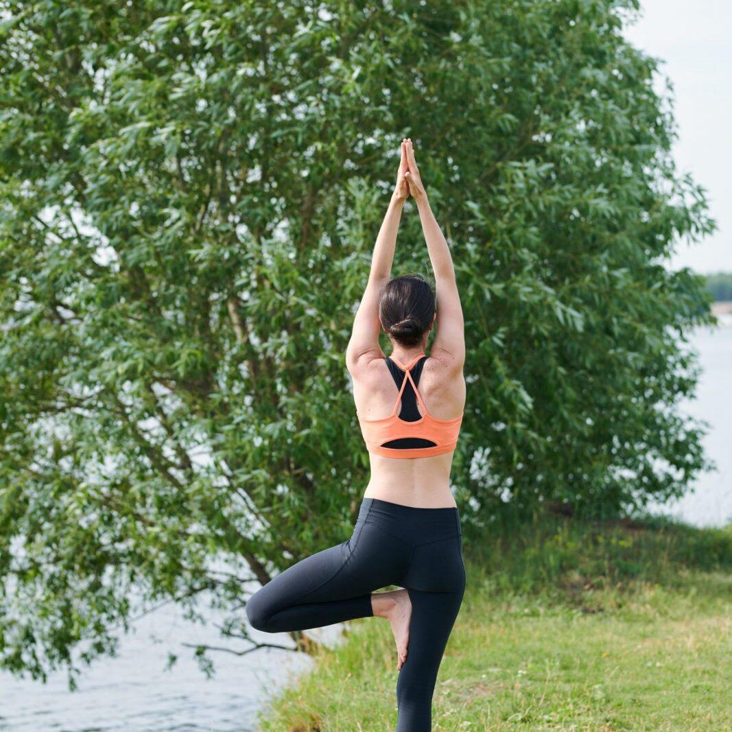 Female balancing on one leg